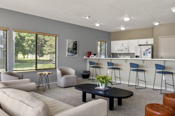 Aurora apartment for rent - A living room with a black coffee table and a white couch.