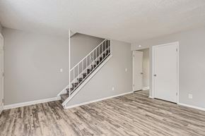 Loveland townhouse for rent - A living Room and staircase at Alder Square Townhomes Apartments