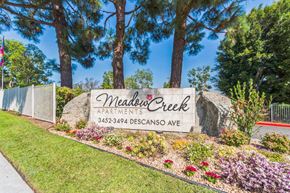 San Marcos apartment for rent - The Monument Sign at the property entrance of Meadow Creek Apartments in San Marcos, CA
