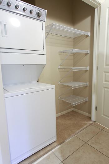 Stackable washer and dryers in select units 