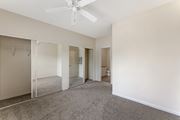 Roseville apartment for rent - Bedrooms at Ascent at the Galleria come with cozy carpeting and ceiling fans, providing comfort and a relaxing atmosphere in every home.