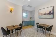 Chandler apartment for rent - A dining room with a table set for two and a view of a cityscape through the window.