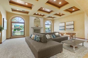 Chandler apartment for rent - A living room with a grey couch and a glass coffee table.