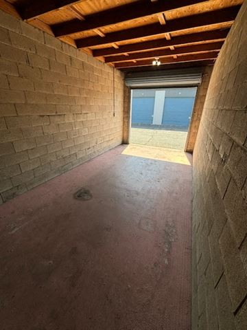Poway apartment for rent - A room with a red floor and wooden ceiling.