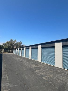 Poway apartment for rent - the side of a building with roll up garage doors