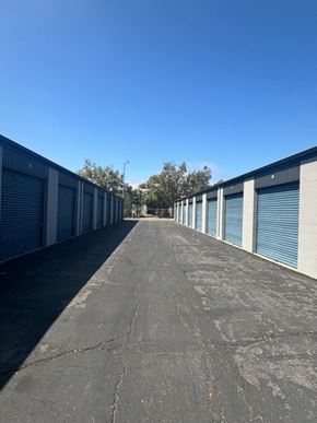 Poway apartment for rent - A long, empty parking lot with a clear blue sky above.