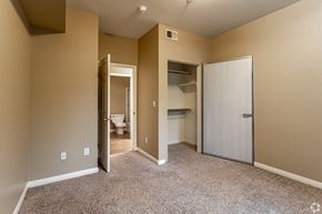 Riverside apartment for rent - The master bedroom features a fully renovated en-suite bathroom and plush carpeting, creating a fresh and comfortable retreat.at The Hills at Quail Run, CA, 92507