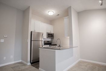 Fitted kitchen with island dining