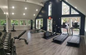 Kirkland apartment for rent - a gym with a lot of equipment and windows