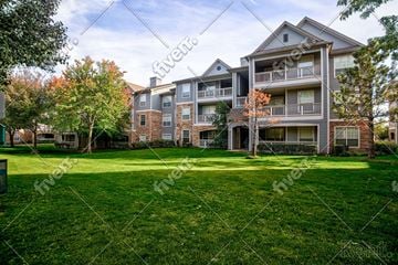 Tulsa apartment for rent - A large grassy area in front of apartment buildings.