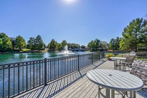 Frisco apartment for rent - Deck with chairs overlooking the community lake  at Cypress Lake at Stonebriar Apartments, Texas