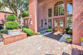 Dallas apartment for rent - Exterior view of brick leasing office at Gates de Provence Apartments, Texas