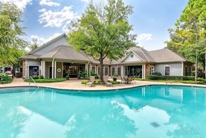 Dallas apartment for rent - A gym with treadmills, weights, and exercise equipment.