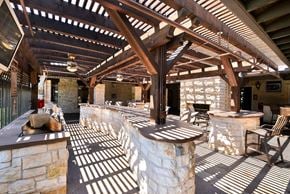 Frisco apartment for rent - Outdoor grilling area with stone countertops at Cypress Lake at Stonebriar Apartments, Frisco, Texas
