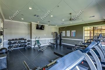 Tulsa apartment for rent - A gym with treadmills, weights, and exercise equipment.