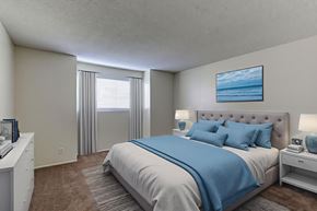 Escondido apartment for rent - A bedroom with a large bed and a painting of a beach scene on the wall.