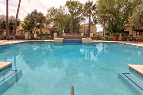 Tucson apartment for rent - A swimming pool with a blue tinted water.