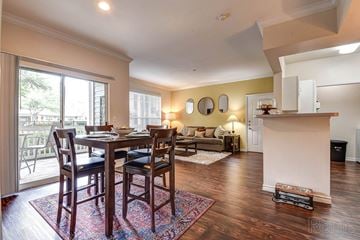 Tulsa apartment for rent - A dining room with a table and chairs.
