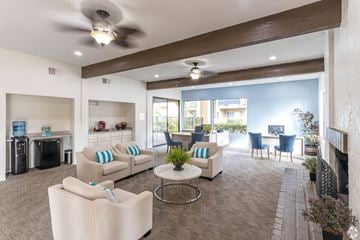 Escondido apartment for rent - A living room with a white couch and a ceiling fan.