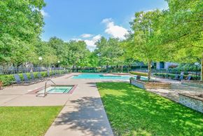 Dallas apartment for rent - a park with a swimming pool and trees at Greysons Gate Apartments, Dallas, TX