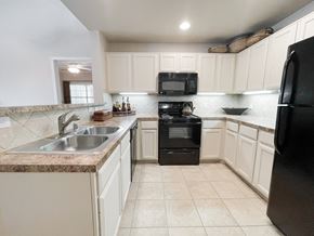 Dallas apartment for rent - Interior kitchen with granite countertops at SaddleBrook Apartments, Texas