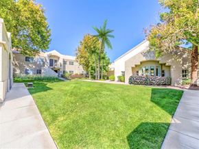 Las Vegas apartment for rent - Outside community clubhouse with green grassy area on a sunny day at Country Club at Valley View - 55+ Senior Community Apartments, Nevada, 89102