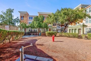 Henderson townhouse for rent - A red fire hydrant sits in the middle of a grassy area.