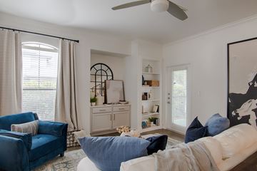Frisco apartment for rent - A living room with a blue couch and a white couch.