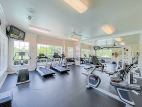Dallas apartment for rent - Modern fitness center and white walls at Turnberry Isle Apartment Homes, Texas