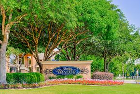 Irving apartment for rent - Property signage with trees at Winsted at Valley Ranch, Texas