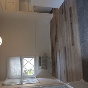 Valley Village apartment for rent - A white bathroom with a window and a shower.