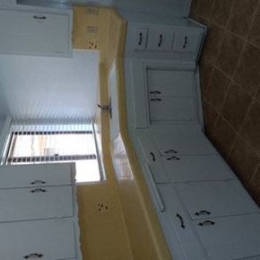Valley Village apartment for rent - A white cabinet with drawers and a yellow cabinet with drawers are in a room.