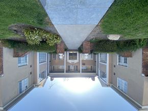 Valley Village apartment for rent - A building with a green roof and a courtyard in the middle.