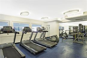 Los Angeles apartment for rent - a gym with cardio equipment and windows in a building
