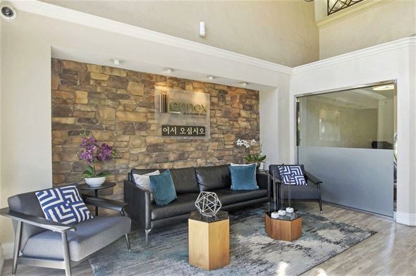 Los Angeles apartment for rent - a living room with a stone wall and a couch