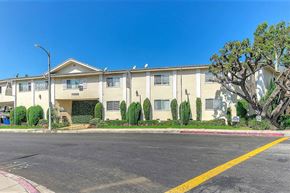 Los Angeles apartment for rent - Apartment complex with a tree in front.
