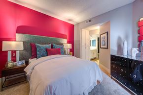 Los Angeles apartment for rent - a bedroom with a large bed and a dresser in front of it