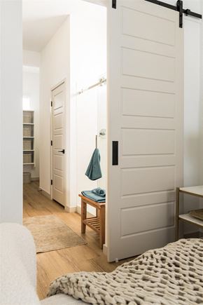 Gilbert apartment for rent - a bedroom with a bed and a closet with a white door at Villas on Ash, Gilbert