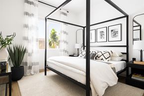 Gilbert apartment for rent - a bedroom with a bed and a black canopy bed at Villas on Ash, Gilbert, AZ