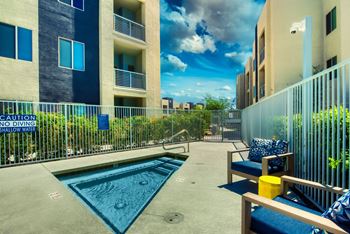 A pool with a sign that says no diving shallow water.