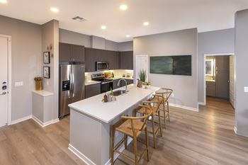 Quartz kitchen countertops with tile backsplash