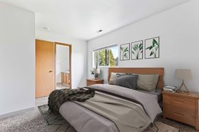 Post Falls townhouse for rent - a bedroom with a bed and two night stands
