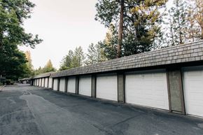 Coeur D'alene apartment for rent - a row of garages with white garage doors and a roof