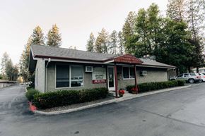 Coeur D'alene apartment for rent - a small gray building with a sign on the side of it