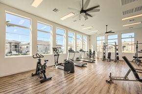 Apache Junction apartment for rent - Gym with cardio equipment and a large window at Hampton Meridian, Apache Junction