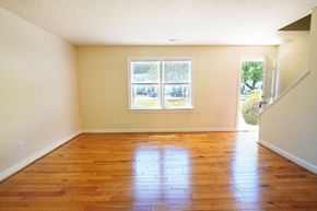 Newport News townhouse for rent - Empty room with wooden floors and a window.