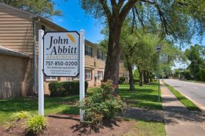 Hampton apartment for rent - A sign for John Abbitt Apartments is displayed in front of a building.