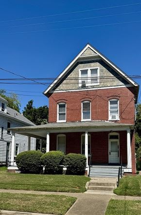 Newport News townhouse for rent - A red brick house with a white door and windows.
