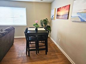 Newport News apartment for rent - a dining room with a table and chairs and a couch