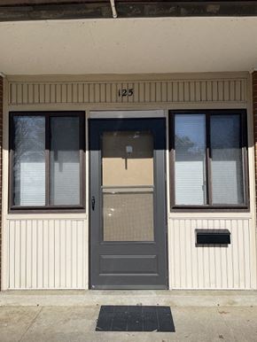Newport News apartment for rent - the front of a building with a gray door